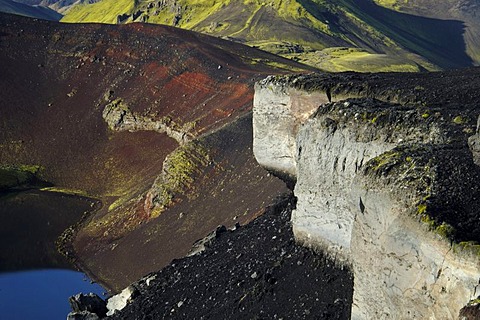 Red scoria and moss the caldera of the Ljotipollur volcano Iceland