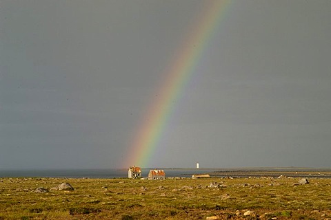 Rainbow and abandoned farm Melrakkasletta peninsula Iceland