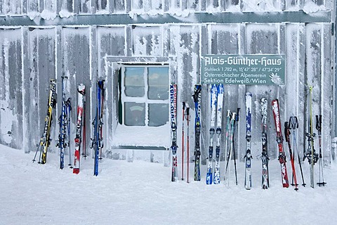 Ski lean on the wall of the Alois Gunther mountain hut on top of the mountain Stuhleck Styria Austria