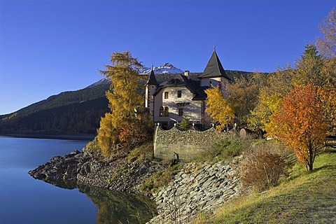 A villa built like a castle at the Reschen lake, Reschen pass, South Tyrol, Italy