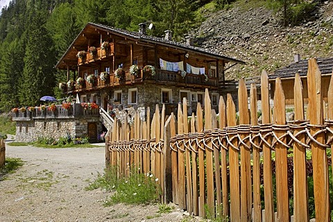 Traditional made wooden fence at the remote mountainfarm and inn called Kofler between the walls, South Tyrol, Italy