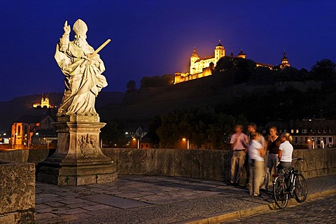 Fortress Marienberg and a statue of St.Kilian on the old bridge over the Main river, Wuerzburg, Bavaria, Germany