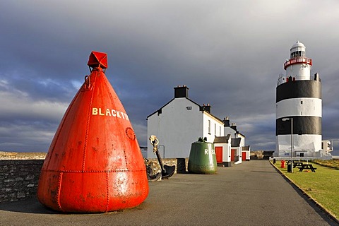 Buoy at the lighthouse of HookÂ¥s Head which is dating back to the 13.th century, County Wexford, Ireland