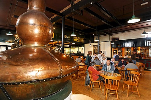 An old pot still (a giant copper kettle) used for the distillation in the Bushmills Whiskey Distillery, Bushmills, Londonderry, North Ireland