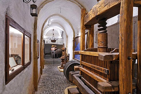 An old wooden vine press, wine museum and vinery Koutsouyanopoulos, Santorini, Greece