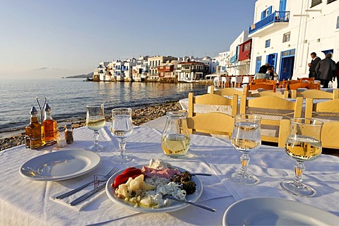 Greec appetizers and the view from a restaurant to Little Venice, Myconos, Greece