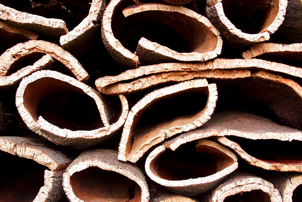 Detail cork oak stacks for drying material Monchique Algarve Portugal