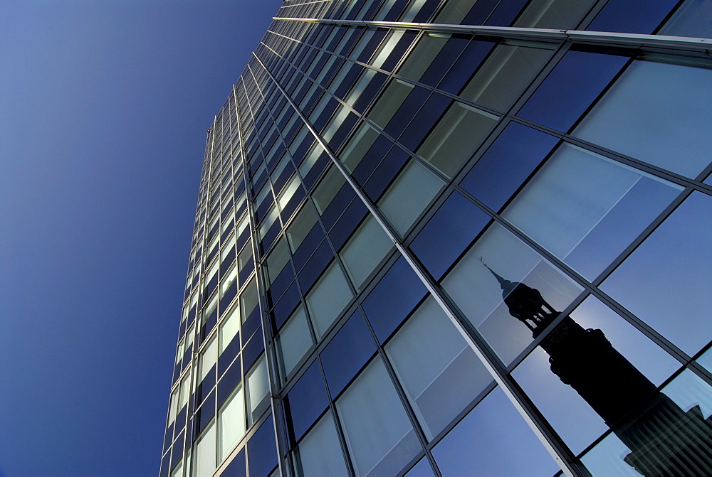 Reflection of St. Michaelis church in a glass front of an office building in Hamburg, Germany