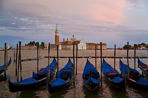 Gondolas at the Piazzetta dei Leoncini, Piazza San Marco Square, view across the Canale di San Marco of San Giorgio Maggiore church in the evening sunset glow, Venice, Veneto, Italy, Europe