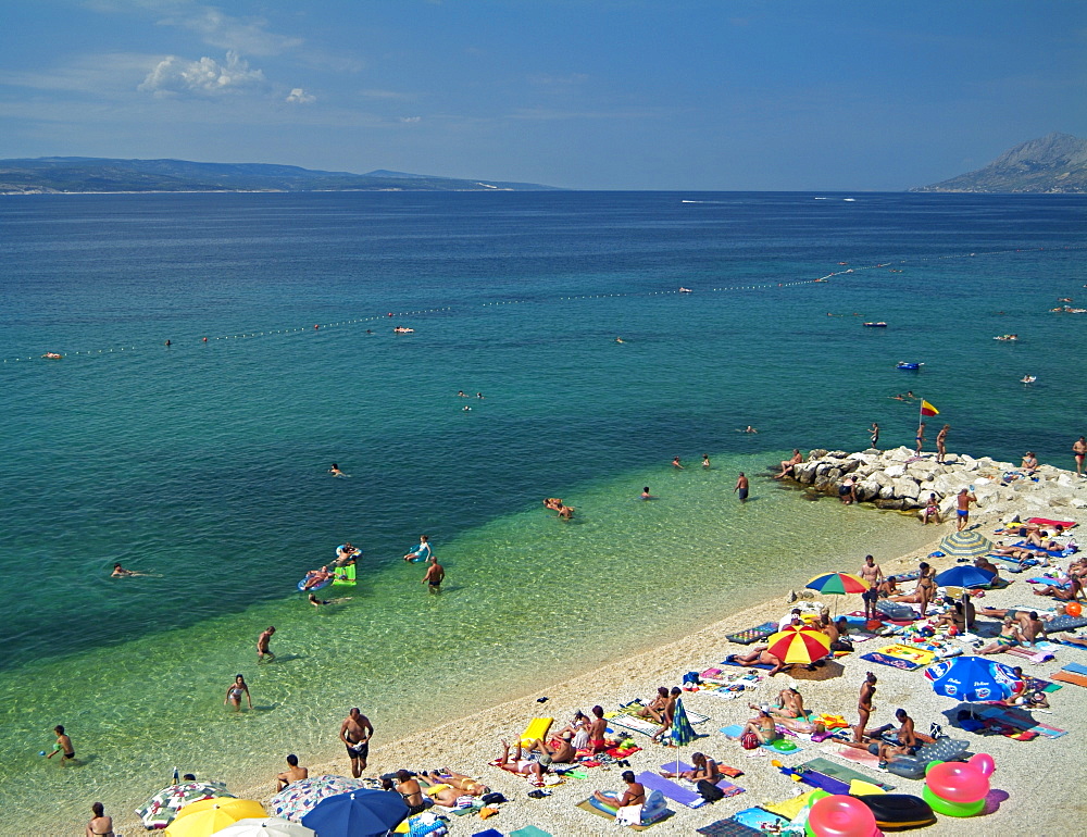 Beach Full of Holiday Makers on Vacation Next to the Adriatic Sea, Baska Voda, Dalmatian Coast, Croatia, Europe.