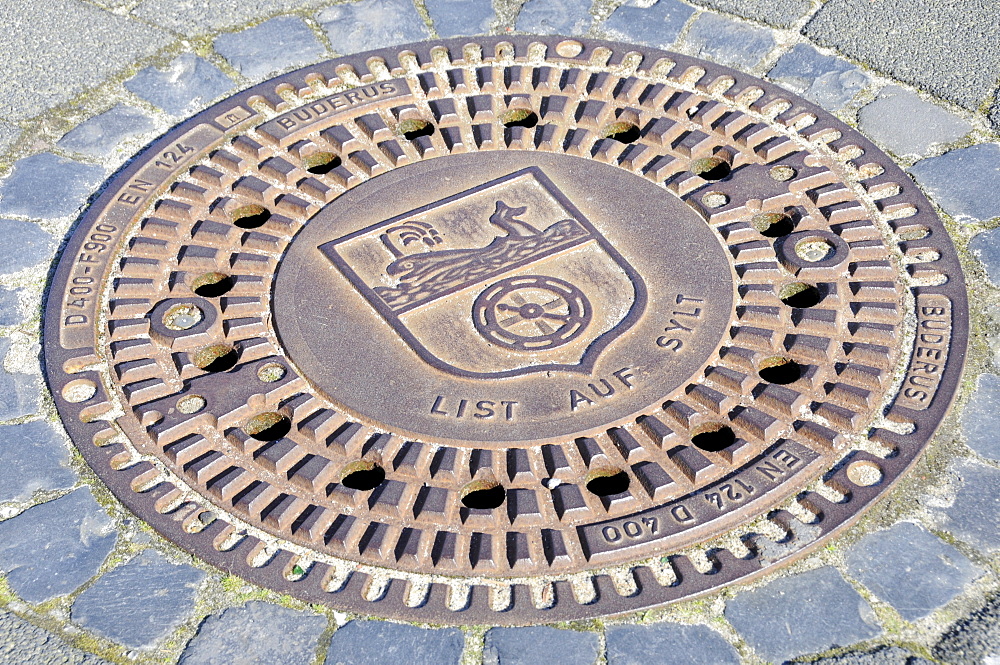 Manhole cover showing the List on Sylt coat of arms, List, Sylt Island, North Frisian Islands, Schleswig-Holstein, Germany