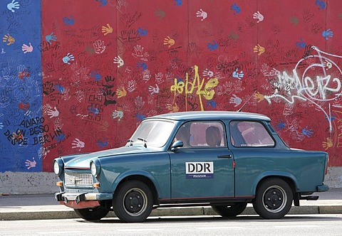 East German car (Trabi) in front of East Side Gallery in Berlin, Germany, Europe