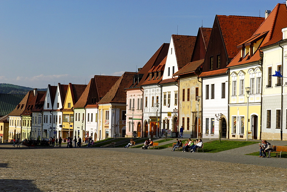 Historic town square of Bardejov surrounded by park benches and renovated old terraced buildings, UNESCO World Heritage Site,  Slovakia, Europe