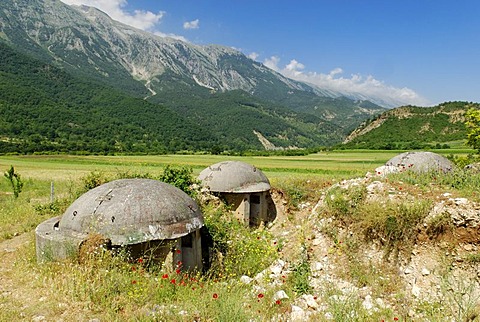 Typical Albanian bunkers in the Vjoses valley, Aoos, with the Nemercke Mountain Range, Albania, Europe