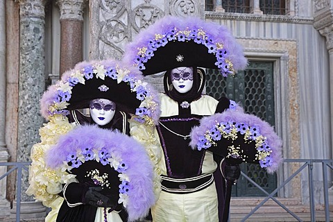 Two masks at the carnival in Venice, Italy