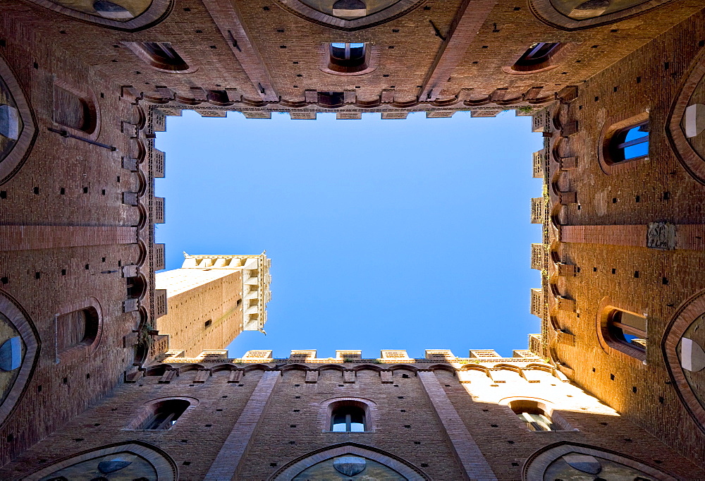 Look from the courtyard of the Palazzo Pubblico on the Torre del Mangia Siena Tuscany Italy