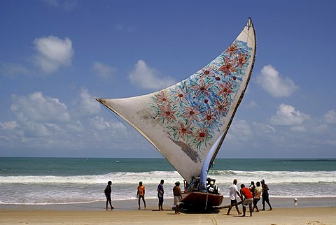 Traditional fishing boat (Jangada) arriving after three days on sea, Iguape near Fortaleza, Ceara, Brazil