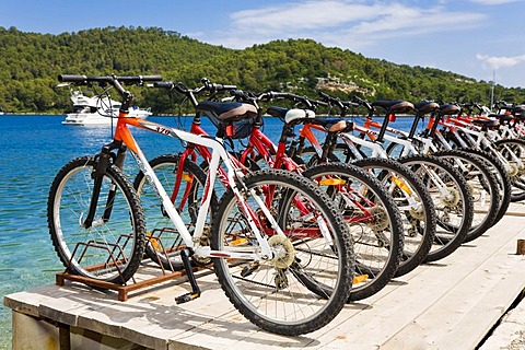 Lined up bicylces, bicycle hire in Polace, Mljet Island, Dubrovnik-Neretva, Dalmatia, Croatia, Europe