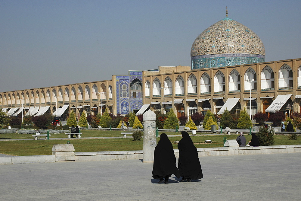 Two veiled women in front of Sheikh Lotf Allah Mosque at Meidan-e Imam (Imam Square), Isfahan, Iran