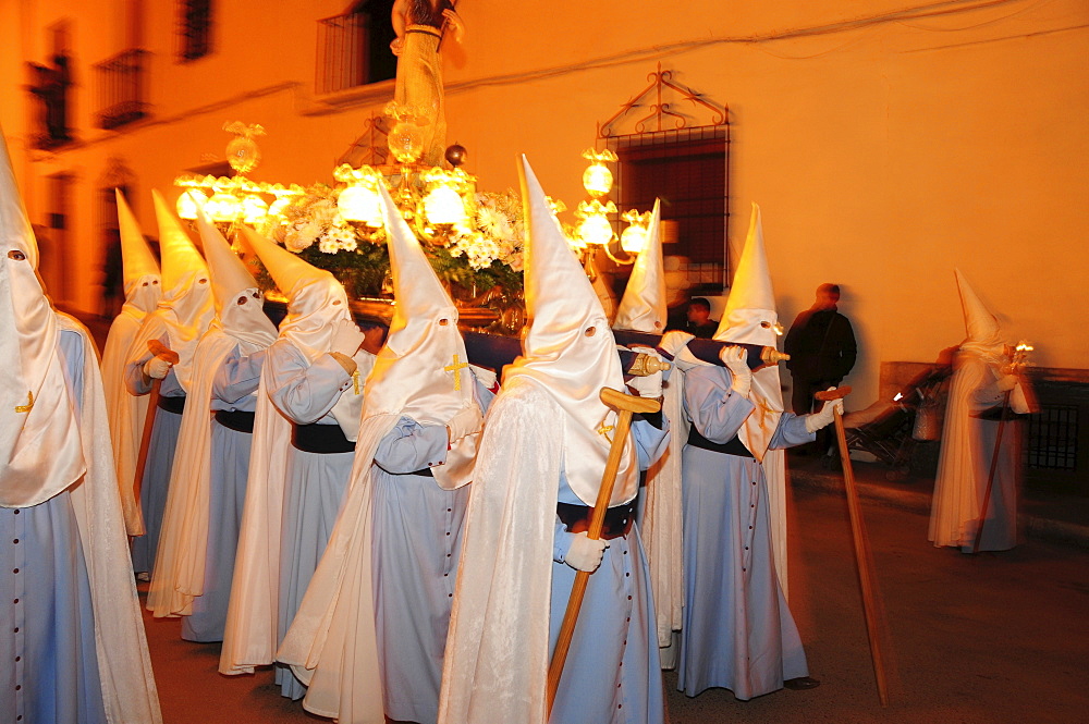 Penitents wearing penitential robes (nazareno), Holy Week procession, Semana Santa, Belmonte, Castilla-La Mancha region, Spain