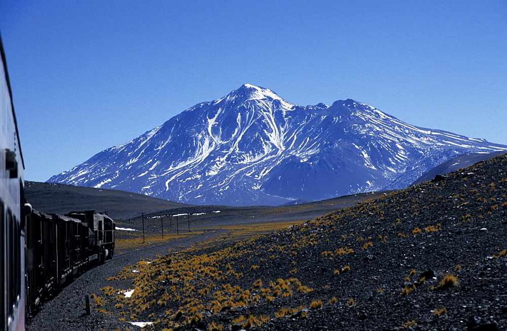 View towards Socompa Volcano (6, 051 m) from the Tren a las Nubes, Cloud Train, near Socompa, Salta Province, Argentina