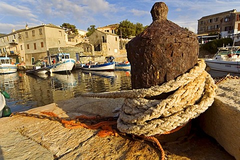 Rusty belayer in the harbour of Centuri, Corsica, France
