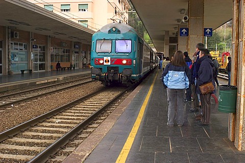 Tourists waiting for the regional train at the station of Levanto, Terre, Liguria, Italy