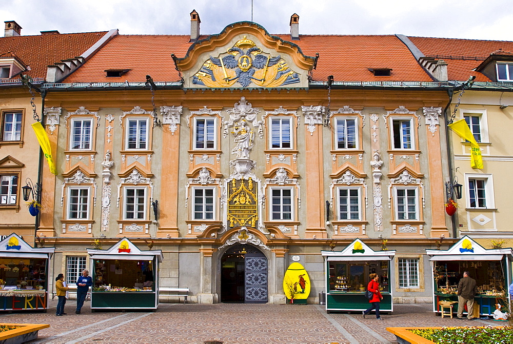 Ornate building facade behind the market stalls on the Main Square of St. Veit, Carinthia, Austria