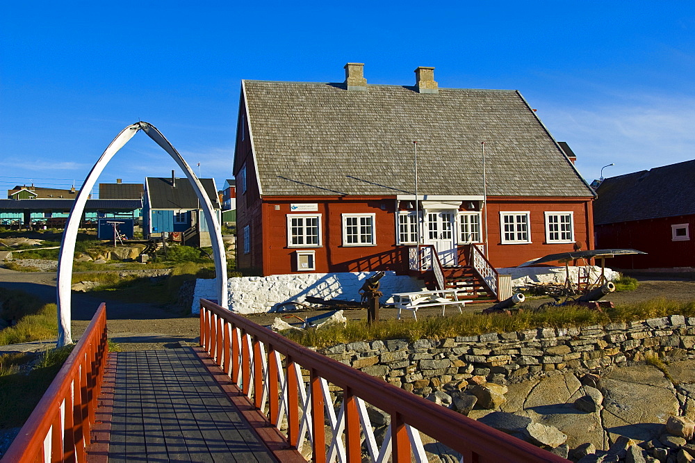 Footbridge leading under an arch made of a whale's jaw bone, Local History Museum, Qeqertarsuaq, Disko Island, Disko Bay, Greenland, Arctic