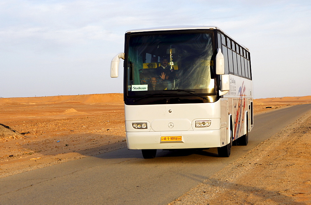 Coach with a package tour group of the German travel agency Studiosus travelling in North Africa, Libya