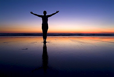 Silhouette of a woman at the beach at sunset, Cable Beach, Australia