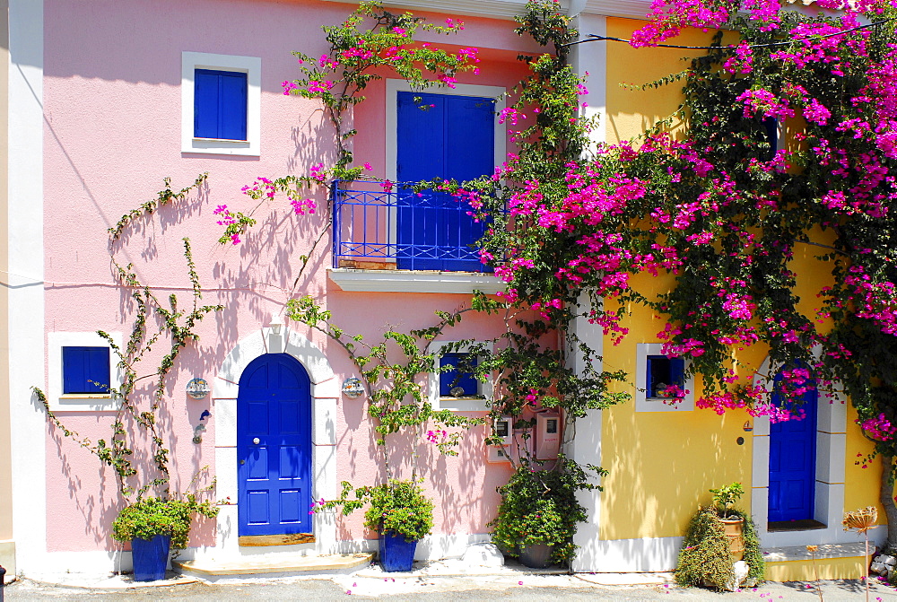 Pink and yellow house, blue shutters, Fiscardo, Kefalonia, Ionian Islands, Greece