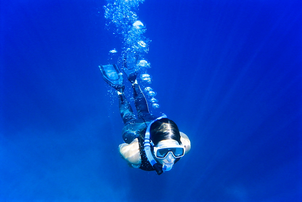 Woman snorkeling, Crete, Greece