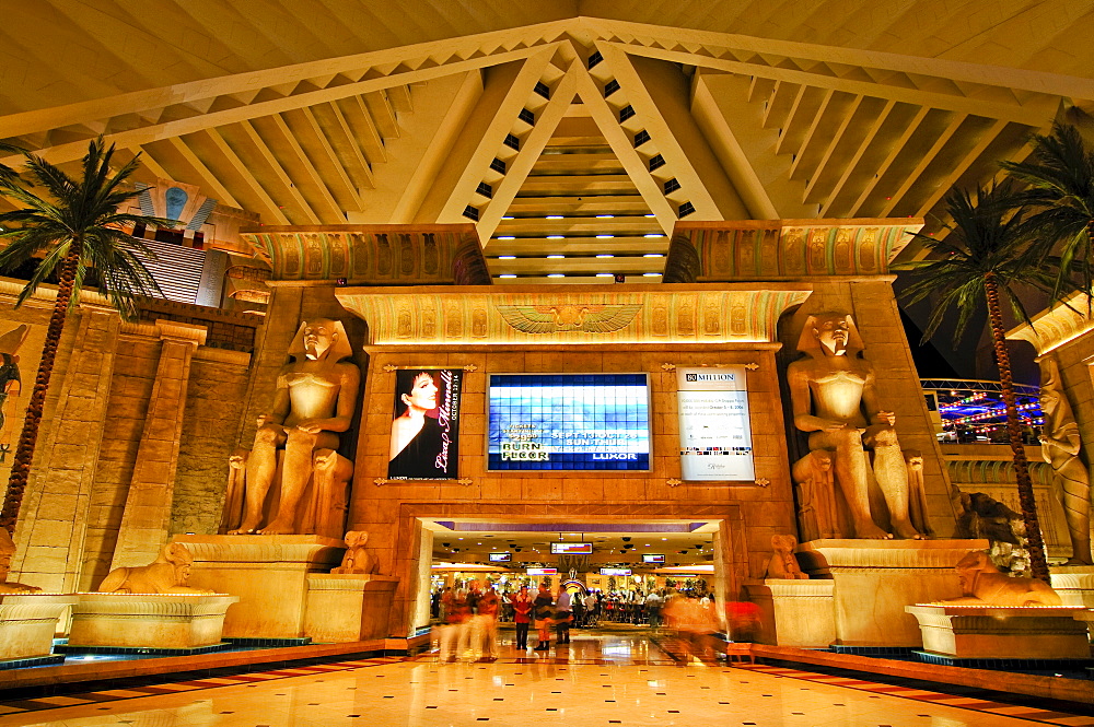 Palms, giant monitor and statues of Tutankhamun in the lobby of the Luxor Hotel & Casino, Las Vegas Boulevard, Las Vegas, Nevada, USA, North America