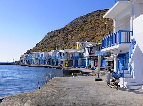 Colourful houses beside the harbour of the fishing village of Klima on Milos Island, Cyclades Island Group, Greece, Europe