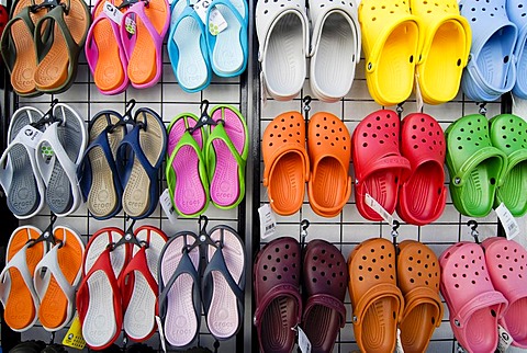 Colourful sandals, Crocs, hanging from a stand at a sales booth, Greece, Europe