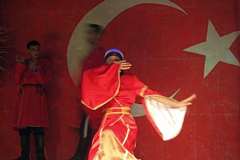 Dancer in front of turkish flag