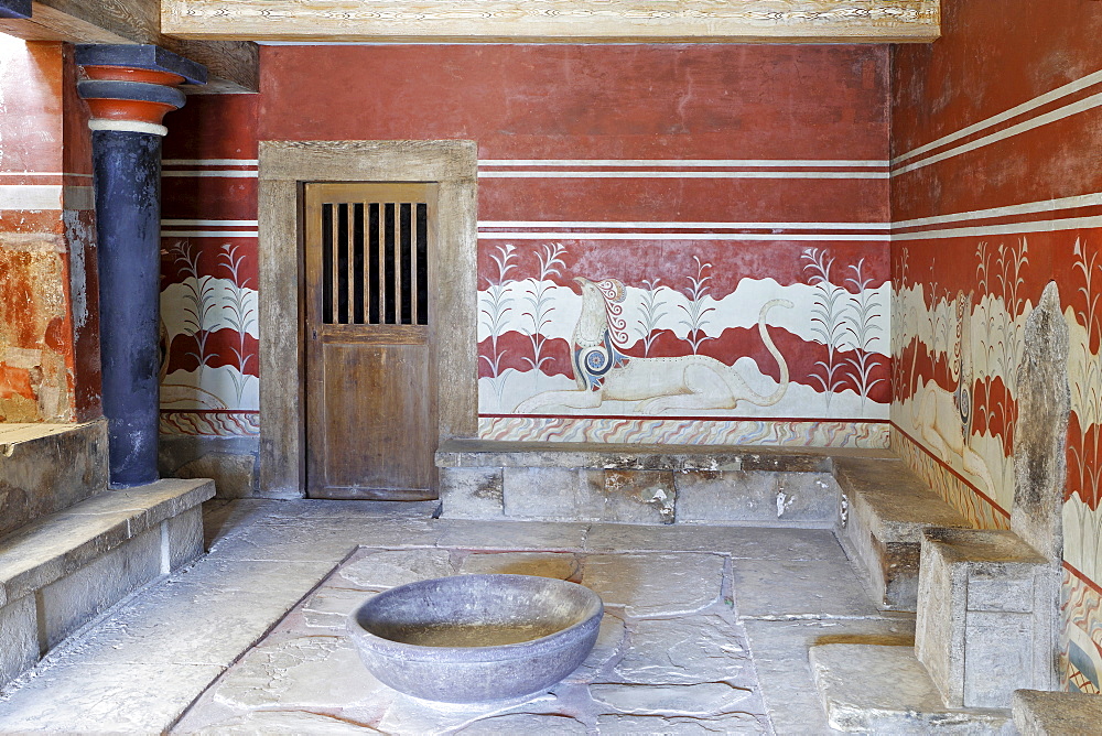 King Minos' alabaster throne surrounded by frescoes depicting chimeric animals in the Palace of Knossos, Crete, Greece, Europe