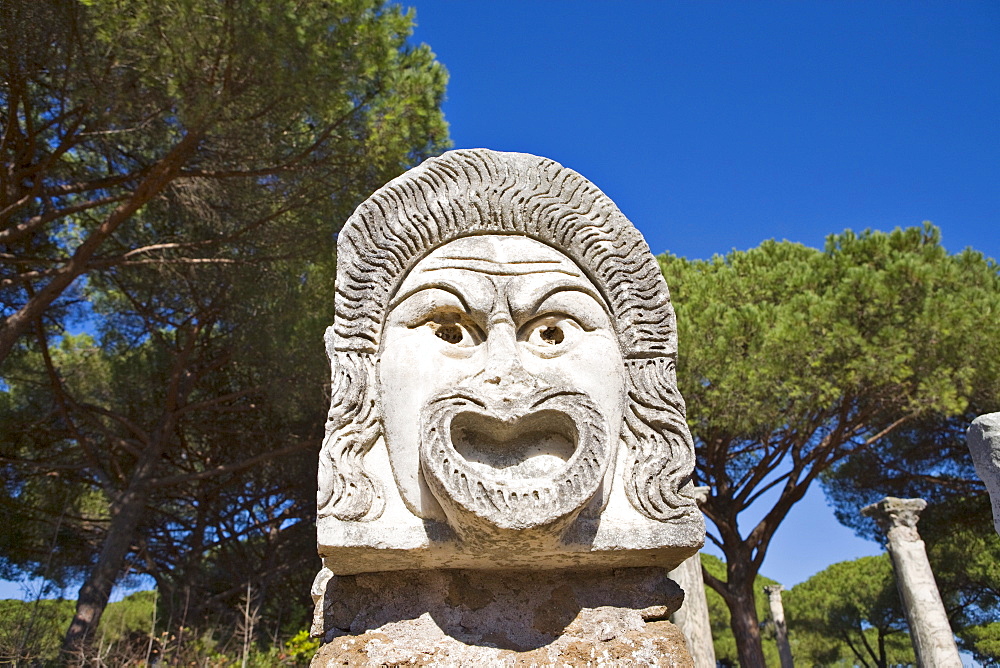 Comical masks at the amphitheatre at Ostia Antica archaeological site, Rome, Italy, Europe