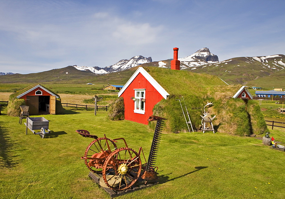 Old equipment in the garden in front of a sod house (Lindarbakki House), Bakkagerï£¿i, Iceland, Atlantic Ocean