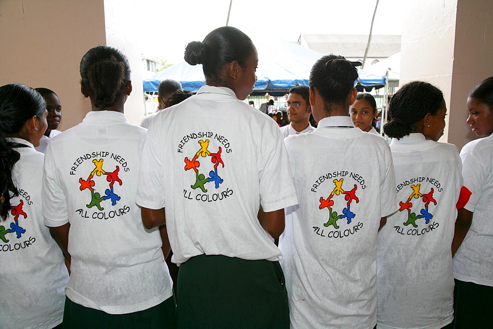 T-shirts showing symbol for cooperation between people of various ethnic backgrounds during a protest against violence against women in Georgetown, Guyana, South America