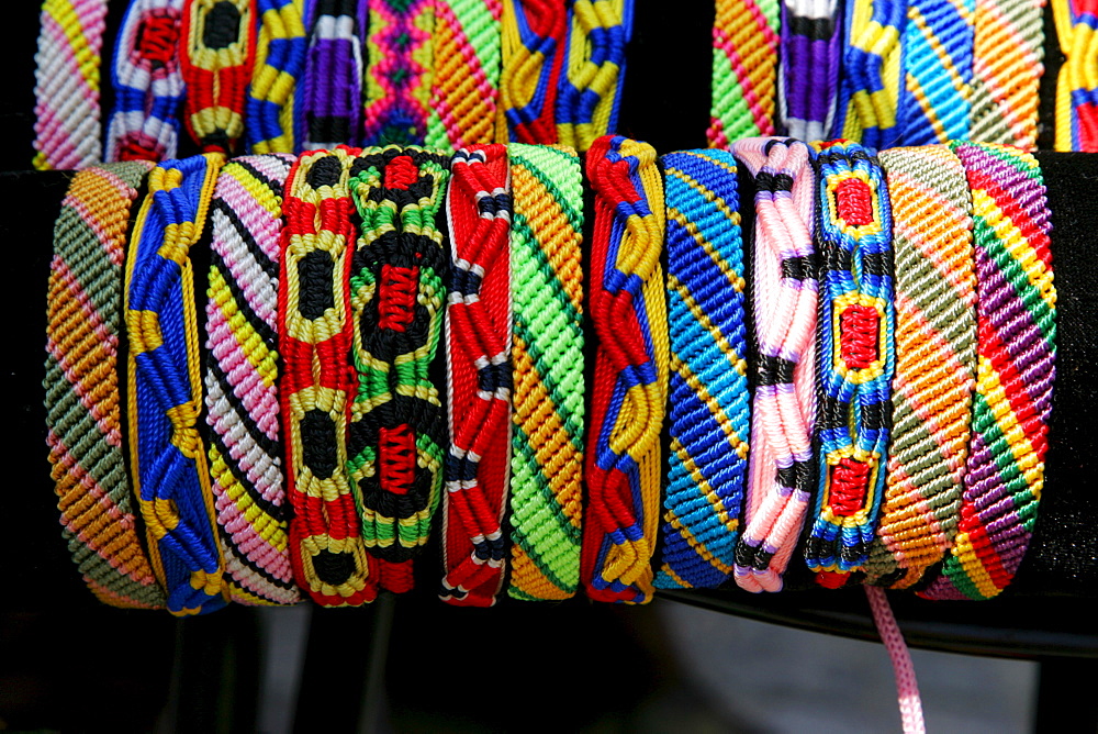 Colourful woven friendship bracelets sold at a market stand, Simonis Market, Muehldorf am Inn, Bavaria, Germany