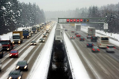 Highway at wintry road conditions, traffic jam on the higway