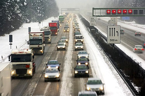 Highway at wintry road conditions, traffic jam on the higway