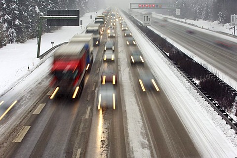 Highway at wintry road conditions, traffic jam on the higway