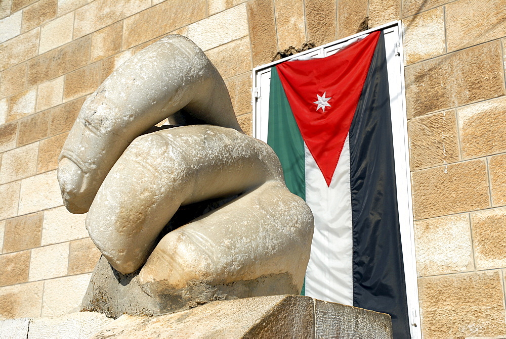 Fingers of the Statue of Hercules and the Jordanian Flag in front of the Archaeological Museum, Jebel al-Qala, Amman, Jordan