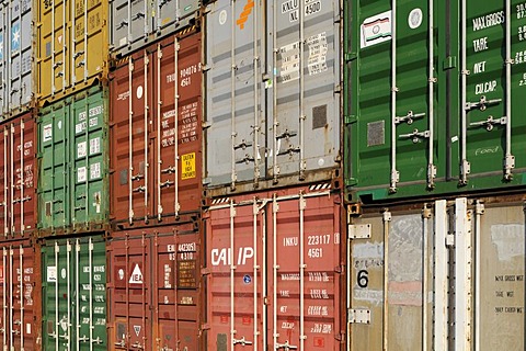 Sloping view of stacked overseas containers, format-filling