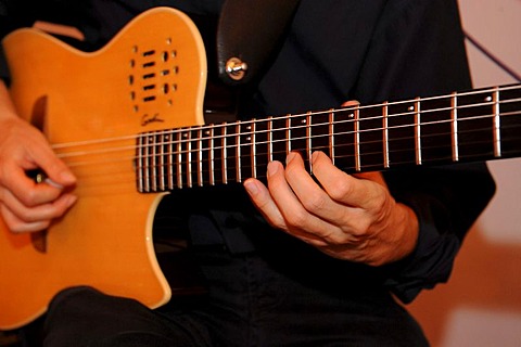 Man playing an electric guitar