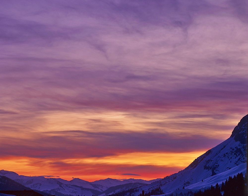 Mountain panorama set against a glowing night sky