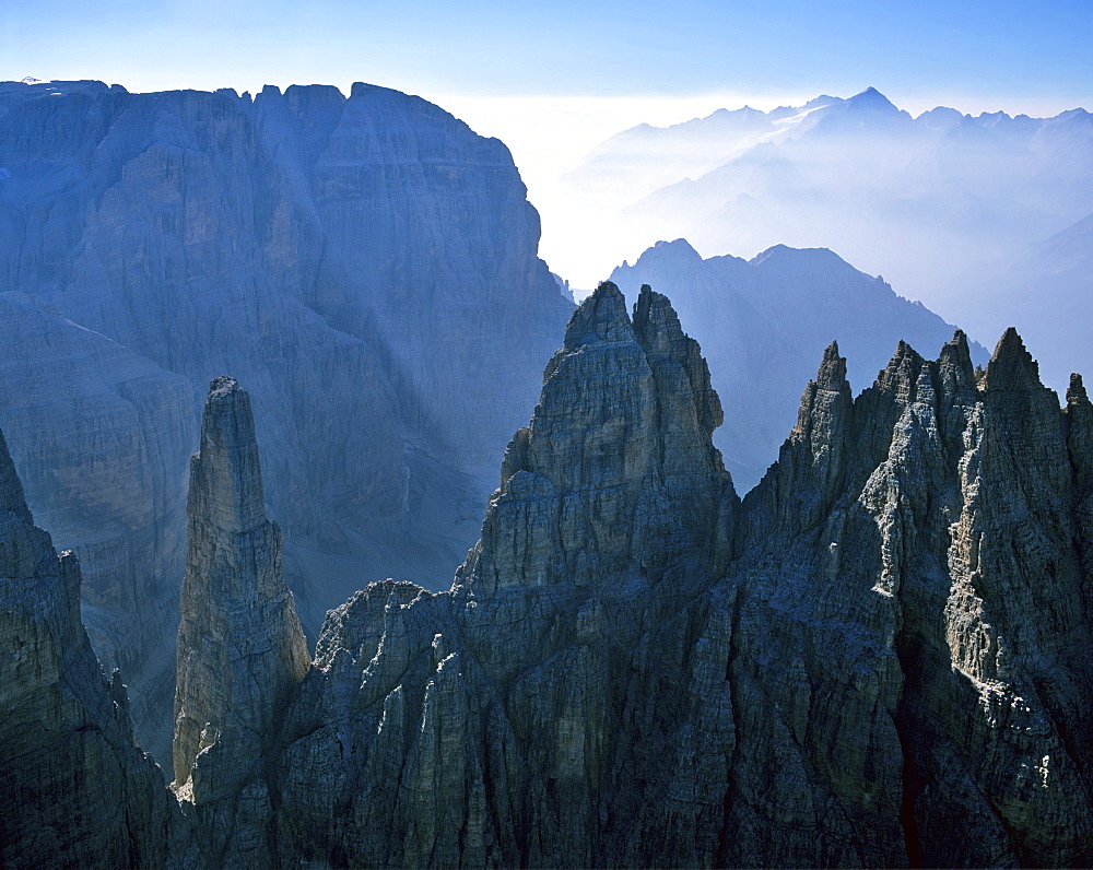 Guglia di Brenta, Campanile Basso and Mt. Cima Tosa (Brenta Group) on the left and to the right in the background Mt. Adamello, Dolomites, Italy, Europe